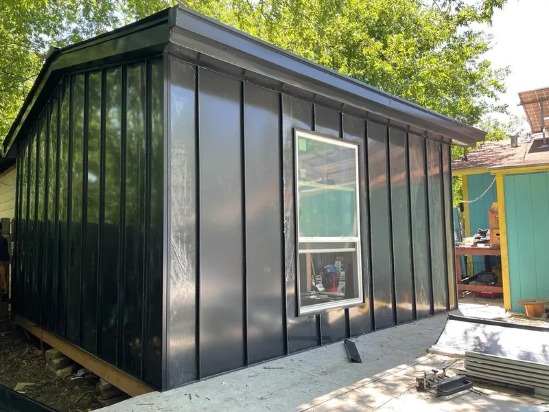 Black standing seam metal wall panels for Roof Inspection in Locust Grove